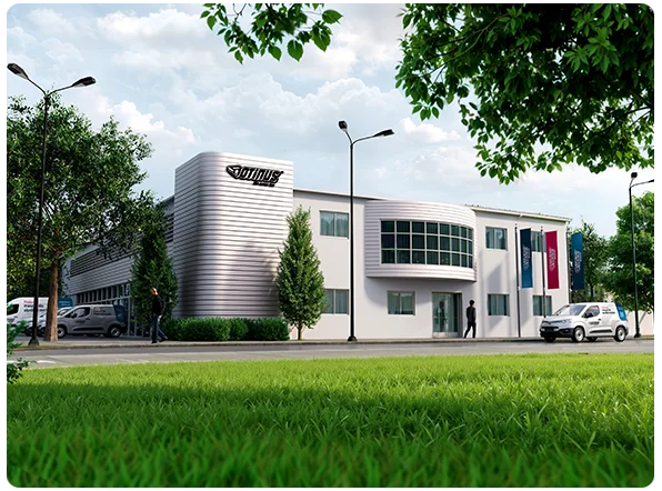 Ujęcie na główny budynek Otinus z showroomem i biurami, przed którym stoją firmowe flagi z logo oraz zaparkowany służbowy samochód.