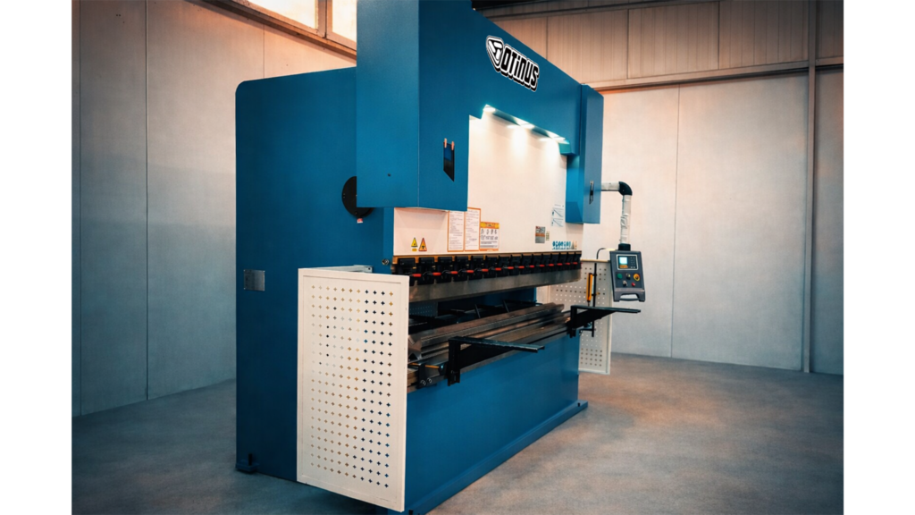 Side view of an industrial Otinus press brake with an ESTUN control system, equipped with precision bending tools and an operator panel, located in a production hall.